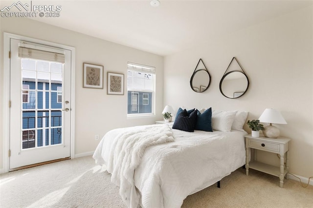 bedroom featuring light carpet and baseboards