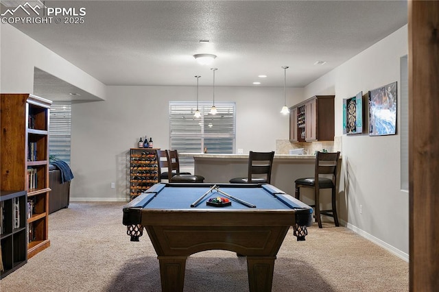 rec room featuring recessed lighting, light carpet, a textured ceiling, and baseboards