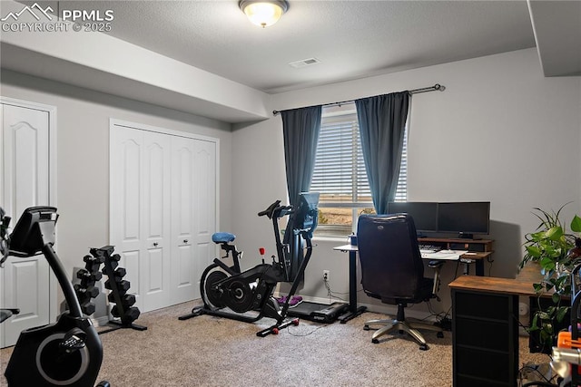 carpeted office featuring baseboards and visible vents