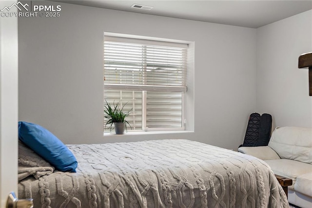 bedroom with visible vents