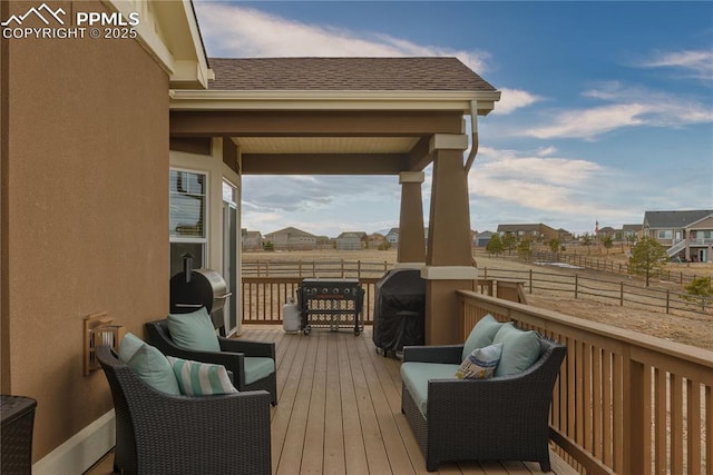 wooden deck with grilling area