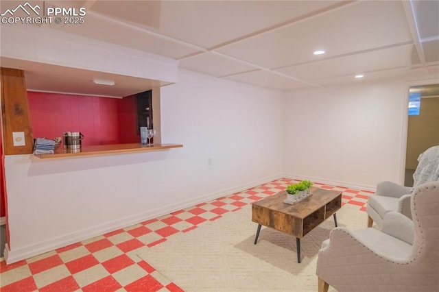 living room featuring recessed lighting, baseboards, and tile patterned floors