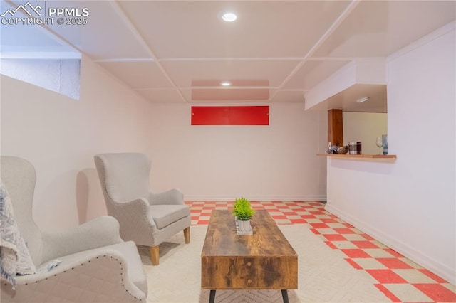 living area with recessed lighting, baseboards, and tile patterned floors