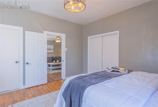 bedroom with a closet and wood finished floors