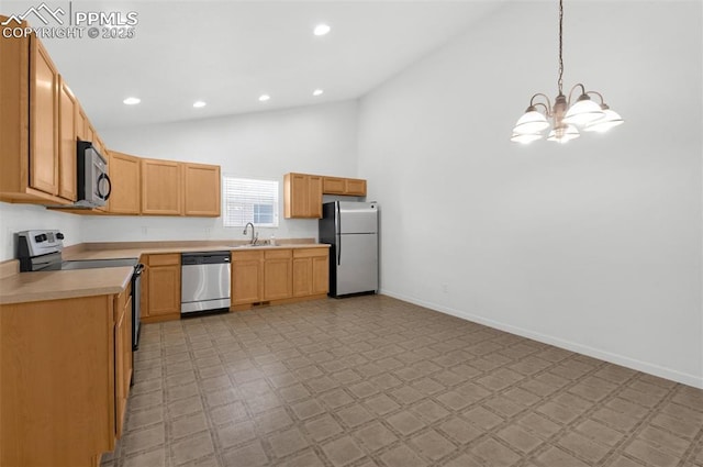 kitchen featuring a sink, baseboards, light countertops, appliances with stainless steel finishes, and light floors