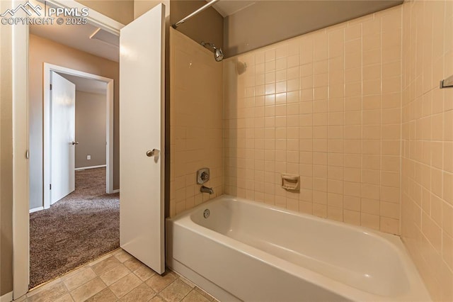 full bath featuring tile patterned flooring and bathtub / shower combination