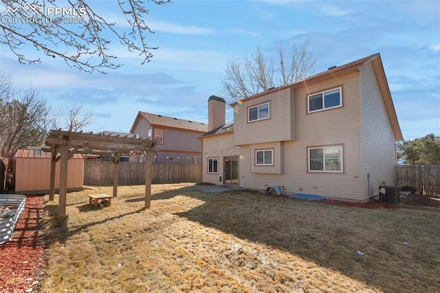 rear view of house with central AC, a lawn, a fenced backyard, and a pergola