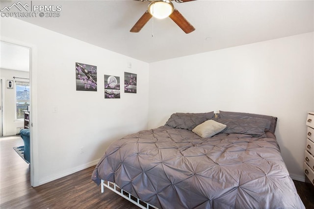 bedroom with dark wood-type flooring, ceiling fan, and baseboards