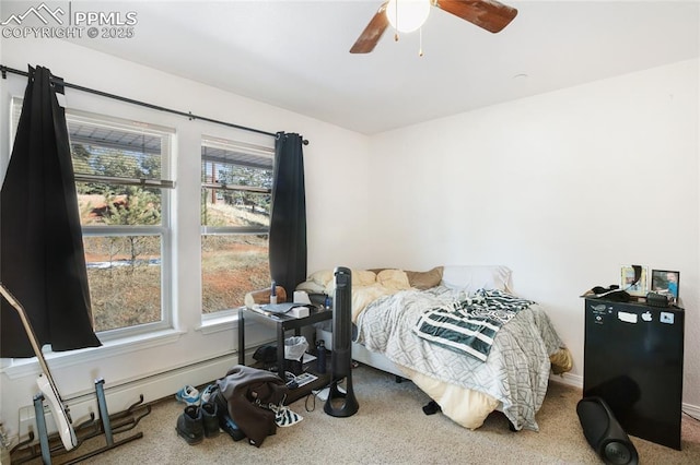 bedroom featuring ceiling fan and baseboard heating