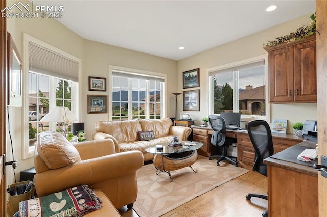 home office featuring light wood-style flooring and recessed lighting