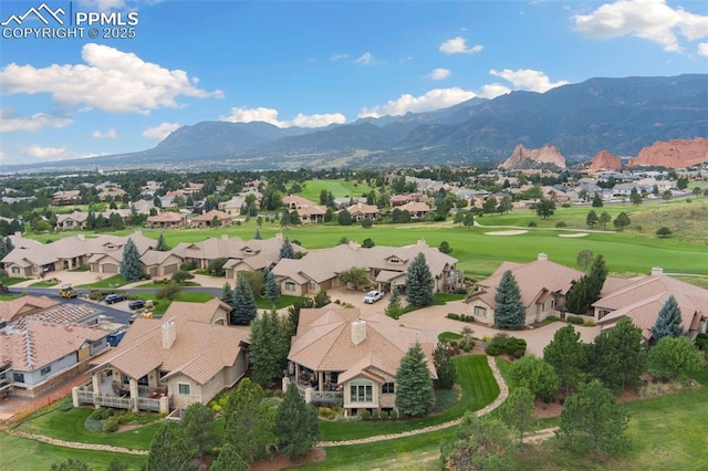 drone / aerial view featuring a residential view and a mountain view