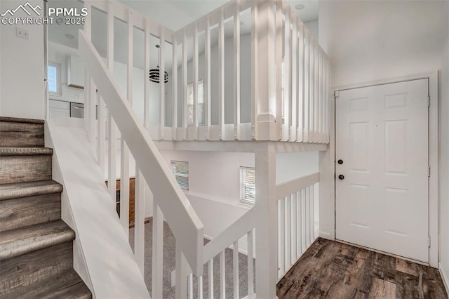 staircase with wood finished floors