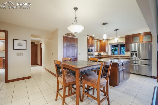 dining area with light tile patterned floors, recessed lighting, and baseboards