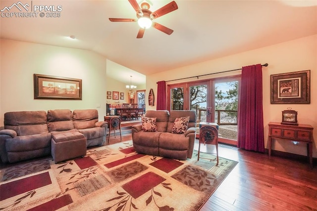 living room with lofted ceiling, french doors, wood finished floors, and ceiling fan with notable chandelier