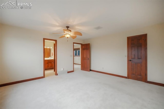 unfurnished room with a ceiling fan, light carpet, visible vents, and baseboards