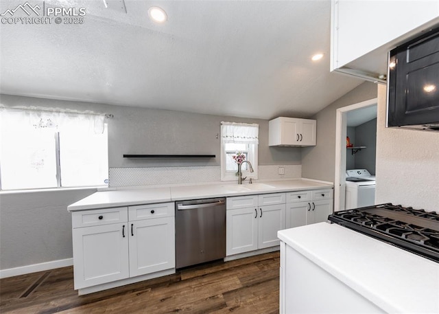 kitchen with light countertops, stainless steel dishwasher, a sink, and white cabinets