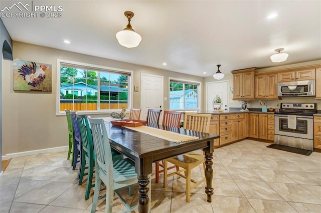 dining space featuring recessed lighting, baseboards, and light tile patterned floors