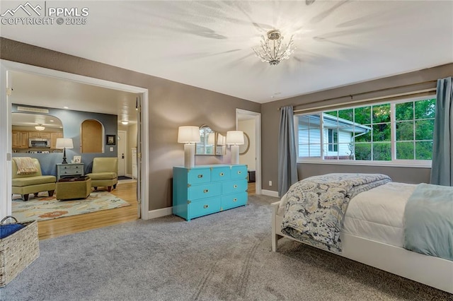 bedroom featuring carpet flooring and baseboards