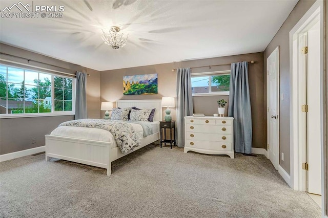 bedroom featuring carpet floors and baseboards