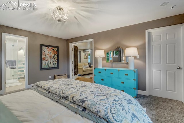 carpeted bedroom with a notable chandelier and baseboards