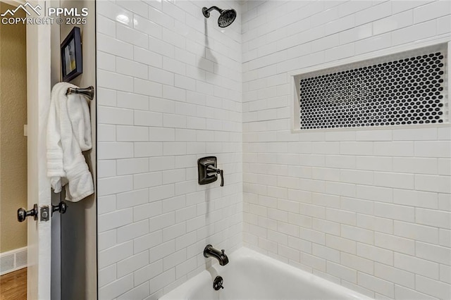 bathroom featuring visible vents and tub / shower combination