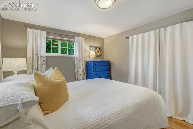 bedroom featuring wood finished floors