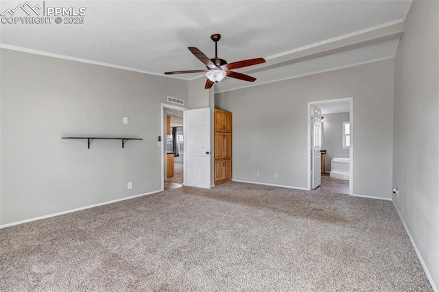 unfurnished bedroom featuring ornamental molding, lofted ceiling, light colored carpet, and baseboards