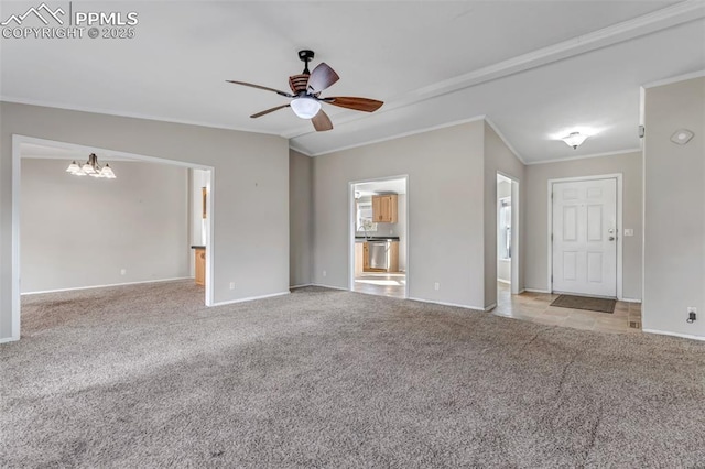 unfurnished living room with lofted ceiling, light colored carpet, ceiling fan with notable chandelier, baseboards, and ornamental molding