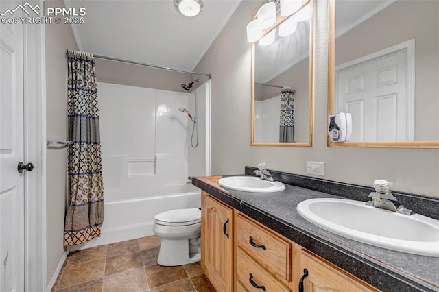 bathroom featuring double vanity, shower / tub combo, a sink, and toilet