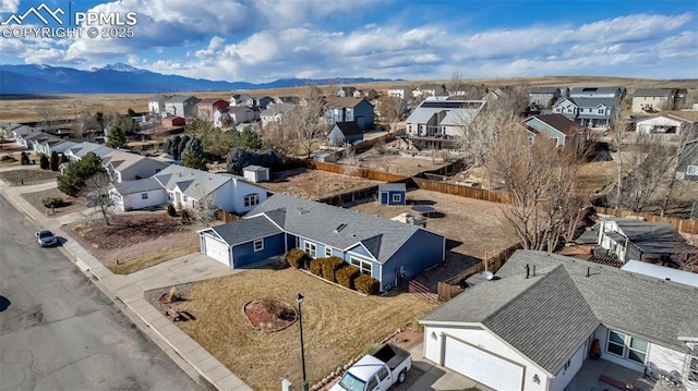 drone / aerial view with a residential view and a mountain view