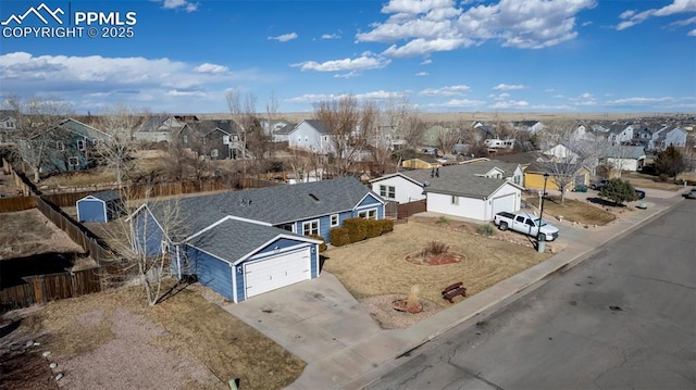 birds eye view of property with a residential view