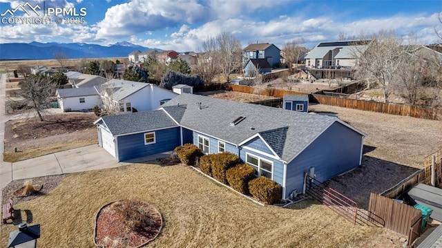 aerial view featuring a mountain view and a residential view