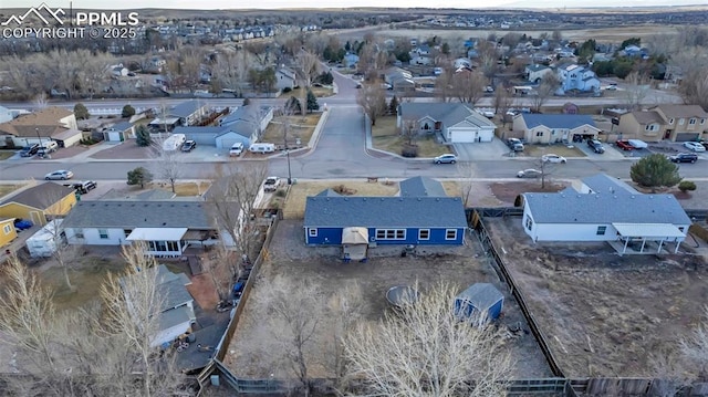 birds eye view of property with a residential view