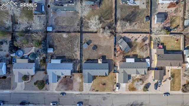 birds eye view of property with a residential view