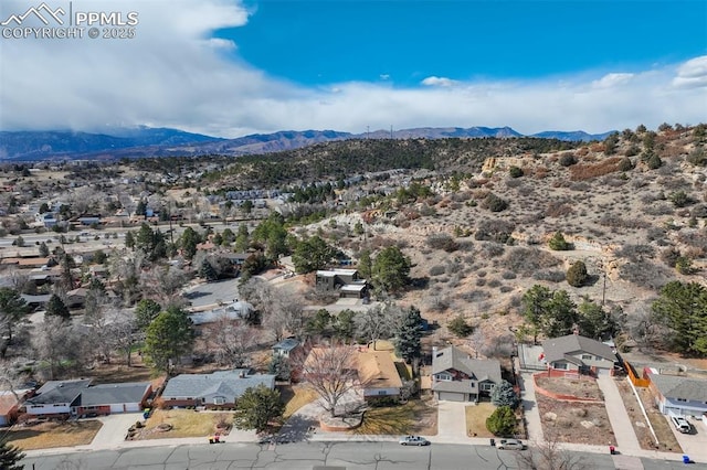 drone / aerial view with a residential view and a mountain view