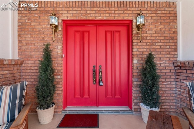 entrance to property with brick siding