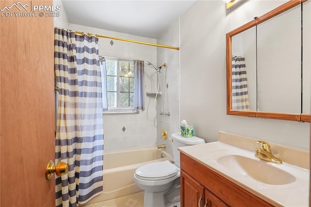 full bathroom with shower / bath combination with curtain, vanity, and toilet