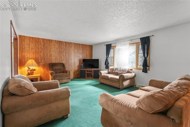 living room featuring a textured ceiling, wood walls, and carpet flooring