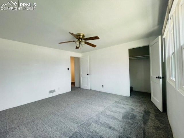 unfurnished bedroom with a closet and carpet flooring