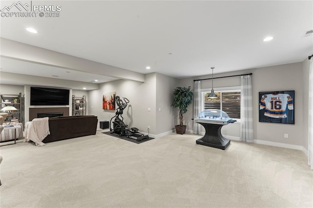 workout room featuring carpet floors, a fireplace, and recessed lighting