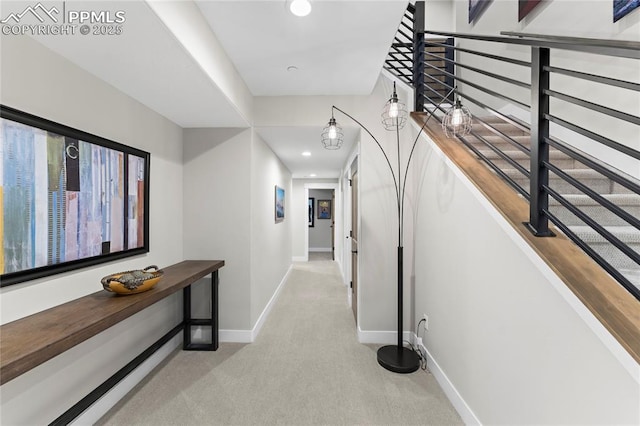 corridor with stairs, carpet floors, recessed lighting, and baseboards