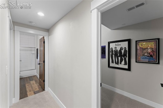 corridor with recessed lighting, carpet, visible vents, and baseboards