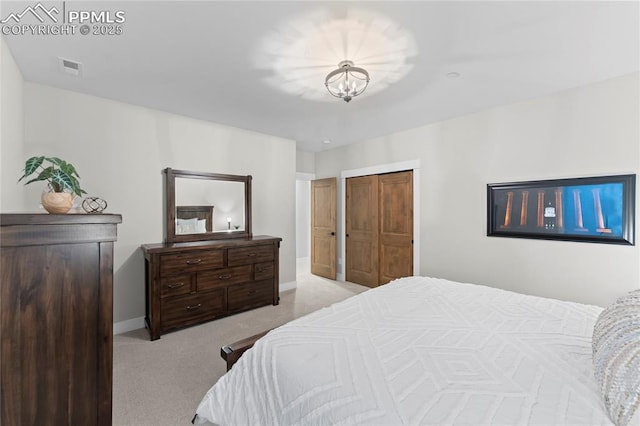 bedroom featuring carpet floors, a chandelier, visible vents, and baseboards