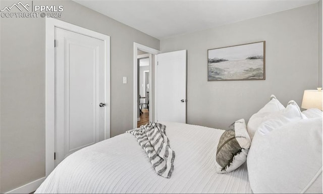 bedroom featuring baseboards