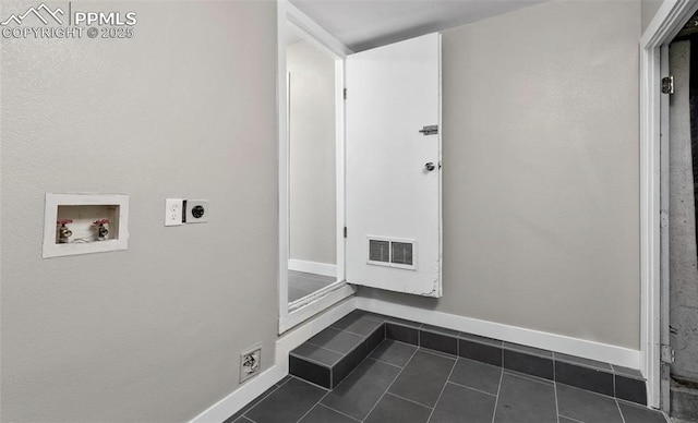 washroom featuring hookup for an electric dryer, laundry area, washer hookup, visible vents, and baseboards