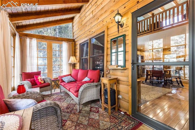 sunroom featuring vaulted ceiling with beams and wooden ceiling