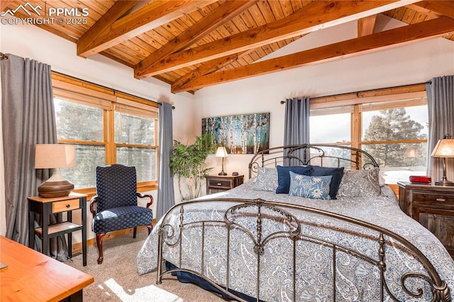 carpeted bedroom featuring vaulted ceiling with beams, wood ceiling, and multiple windows