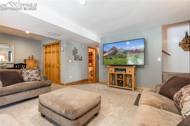 carpeted living area with recessed lighting, visible vents, and baseboards