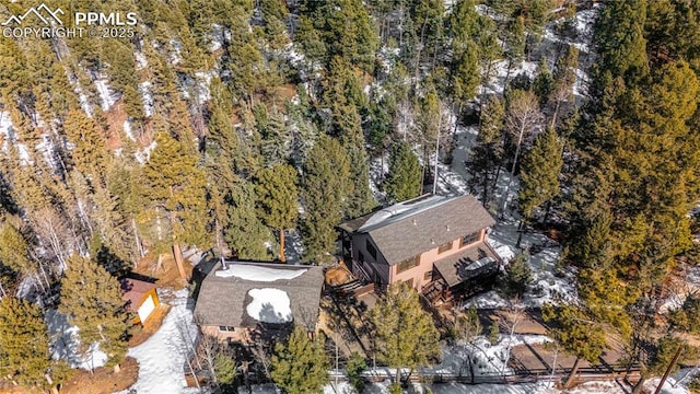 bird's eye view featuring a forest view