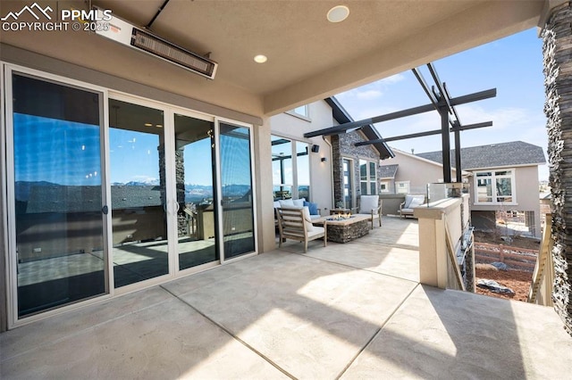 view of patio / terrace with an outdoor fire pit